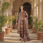 This elegant outfit is in a warm beige color. The long kurta features a collar neck with beautiful shiny beadwork on the chest. The fabric has a lovely floral print with red and green details. It comes with comfortable matching pants and a stylish shawl (dupatta) that has a dark, patterned border. This outfit is classy, traditional, and perfect for casual gatherings and winter days.