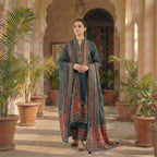 This traditional outfit is in a smart dark grey color. The kurta features a unique wavy line pattern all over and a detailed design on the neck in red and beige colors. It comes with matching pants and a beautiful shawl (dupatta) that has a rich, printed border. This outfit is elegant, comfortable, and perfect for office wear or casual winter days.