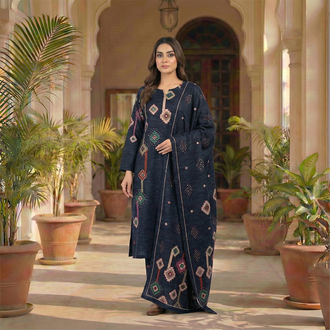 This stylish outfit is in a dark navy blue color. The kurta features unique geometric patterns (like diamonds and shapes) in pink, green, and beige that give it a modern look. It has a simple, comfortable neckline. It comes with matching pants and a warm shawl (dupatta) with the same cool design. This outfit is trendy, cozy, and perfect for casual outings and winter days.