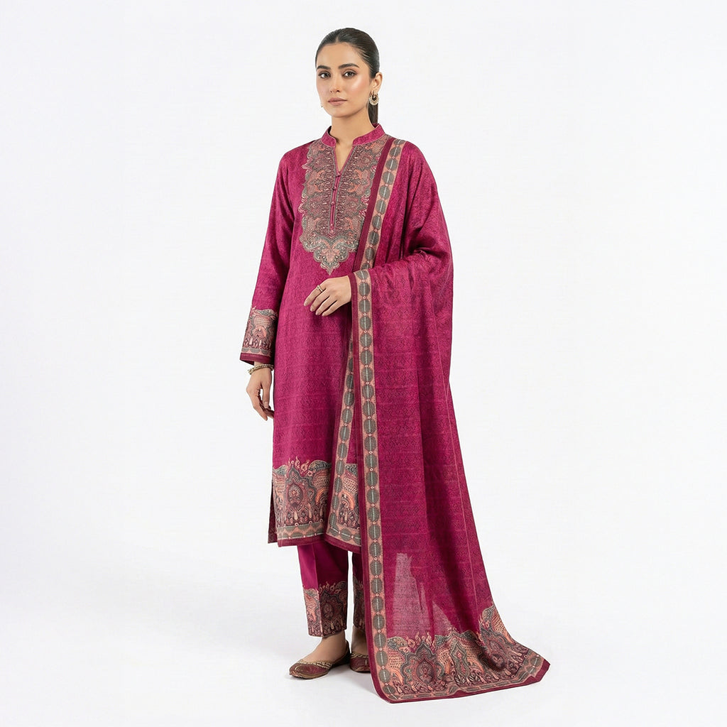 This stylish outfit is in a beautiful deep pink color. The long kurta has a nice pattern all over and a detailed traditional design around the neck. It features long sleeves and a lovely border at the bottom. It comes with matching pants and a warm shawl (dupatta) that has a pretty printed border. This outfit is cozy, elegant, and perfect for winter gatherings and daily wear.