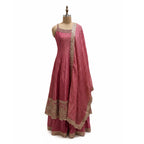 This charming outfit features a deep pink kurta with golden embroidery and small patterned details that give it a traditional yet stylish look. The neckline and borders are beautifully decorated with fine handwork, adding a touch of shine.

The flared bottom palazzo&nbsp; and the striped dupatta with a golden border completes the outfit perfectly.


Light, elegant and festive, this look is ideal for weddings, family gatherings or cultural celebrations where you want to appear graceful and radiant.