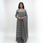 This outfit is in a lovely grey color with pretty silver embroidery all over the front and sleeves. The work is neat and shiny, making it look graceful and stylish.

It has a long, flowy design that looks elegant and is easy to wear. The matching dupatta adds a soft and simple touch to the outfit.

Perfect for parties or special events, this dress is classy, beautiful, and simple.