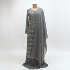 This outfit is in a lovely grey color with pretty silver embroidery all over the front and sleeves. The work is neat and shiny, making it look graceful and stylish.

It has a long, flowy design that looks elegant and is easy to wear. The matching dupatta adds a soft and simple touch to the outfit.

Perfect for parties or special events, this dress is classy, beautiful, and simple.