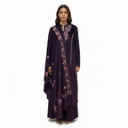 This cozy and stylish outfit is perfect for winter. It is made from soft velvet fabric in a beautiful deep purple color.

The kurta features pretty pink floral embroidery around the neck and shoulders.

It comes with comfortable matching pants and a warm velvet shawl (dupatta) that completes the look. This outfit is elegant, warm, and great for winter parties and family gatherings.