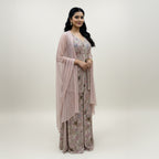 This exquisite outfit comes in a soft pastel pink color with beautiful floral embroidery all over. The top has a stylish front-open design and a flattering neckline that adds a modern touch.

The matching wide-leg pants flow gracefully, giving the outfit a comfortable yet classy look.


A light pink dupatta with a delicate texture completes the set, making it perfect for daytime events, parties or festive occasions where you want to look graceful and chic.