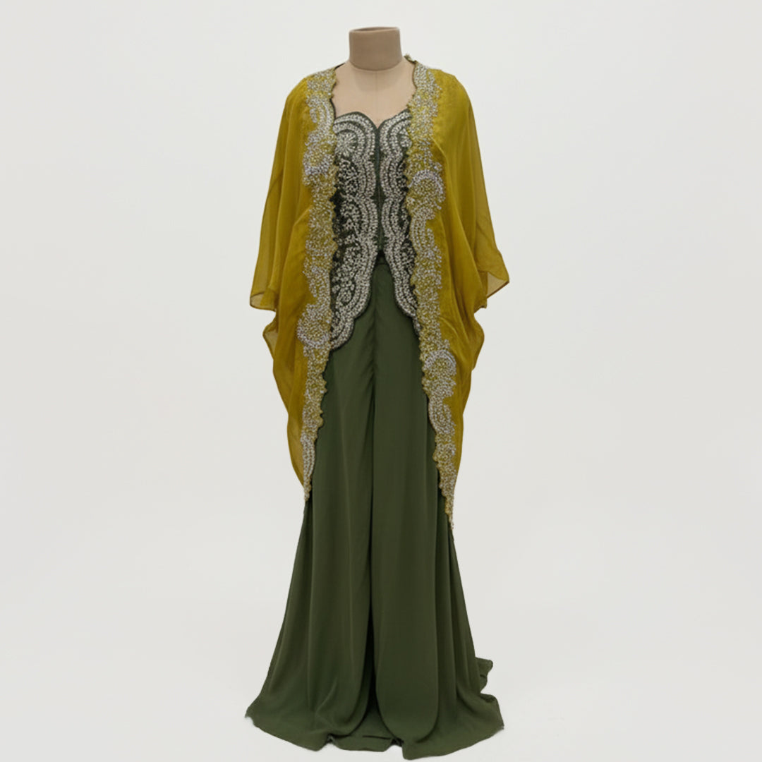 This is an outfit with a stylish twist. It features an dark-green top paired with matching palazzo and a mustard-yellow cape.
The top has beautiful silver embroidery on the front, adding a rich and classy touch. The flowy cape, decorated with heavy embroidery along the edges, gives the outfit a modern and graceful look.
Perfect for formal occasions or festive events, this outfit blends traditional style with a contemporary flair, perfect for parties, wedding and festive look.