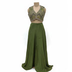 This contemporary ethnic outfit features a sleeveless V-neck crop top shimmering with intricate hand-embroidery, sequins, and beadwork.

It is perfectly paired with floor-length, wide-legged trousers in a coordinating shade of olive green.

The pants are designed with an elegant, draped silhouette, crafted from a lightweight, flowy material that moves beautifully. Perfect for parties, weddings, festive looks