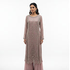 This elegant outfit is designed in a soft blush pink shade with delicate silver embroidery all over, giving it a graceful and classy look. The long kurta features detailed handwork with floral and geometric patterns that add a touch of sophistication.

The matching palazzo pants have a simple yet elegant border that complements the overall design beautifully.&nbsp;Perfect for weddings, receptions or festive occasions, this outfit combines subtle shine with timeless charm, making it ideal for an elegant and 