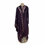 This cozy and stylish outfit is perfect for winter. It is made from soft velvet fabric in a beautiful deep purple color.

The kurta features pretty pink floral embroidery around the neck and shoulders.

It comes with comfortable matching pants and a warm velvet shawl (dupatta) that completes the look. This outfit is elegant, warm, and great for winter parties and family gatherings.