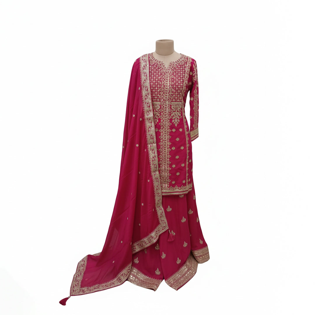 Make a grand entrance in this Fuchsia Rani Pink Silk Set, defined by its dense all-over gold embroidery. The intricate Tilla and Zari work across the bodice creates a luminous effect, perfectly balanced by a scalloped-edge dupatta. Vibrant and traditional, this set is designed for the woman who wants to celebrate the true spirit and color of Indian festivities.