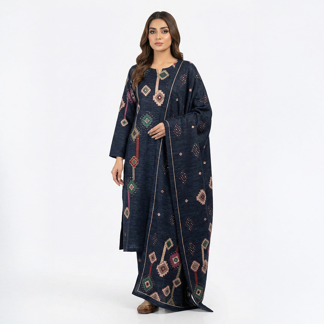 This stylish outfit is in a dark navy blue color. The kurta features unique geometric patterns (like diamonds and shapes) in pink, green, and beige that give it a modern look. It has a simple, comfortable neckline. It comes with matching pants and a warm shawl (dupatta) with the same cool design. This outfit is trendy, cozy, and perfect for casual outings and winter days.
