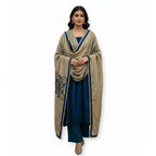 This rich outfit is perfect for the winter season. It is made from soft and warm velvet fabric in a lovely deep teal blue color.

The long kurta has beautiful shiny mirror work and golden patterns on the neckline and sleeves to give it a festive look.

It comes with a contrasting golden dupatta that drapes nicely. This outfit is cozy, elegant, and great for winter weddings and parties.
