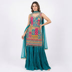 This vibrant outfit is in a rich teal color. The kurta has beautiful multicolored embroidery with detailed patterns and mirror work, giving it a festive look. It comes with a flowy, pleated palazoo and a matching dupatta.

This outfit is bright, elegant, and perfect for weddings, mehndi functions, and festive celebrations.